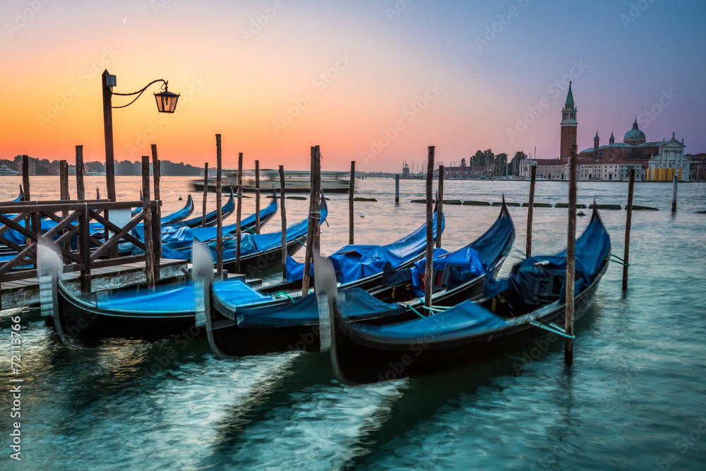 Swinging gondolas in Venice at dawn