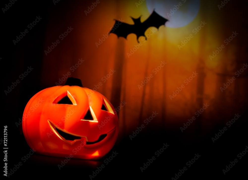 Fototapeta premium Halloween night background with scary bat and pumpkin