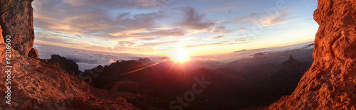 Fiery sunrise over a mountain landscape © stryjek