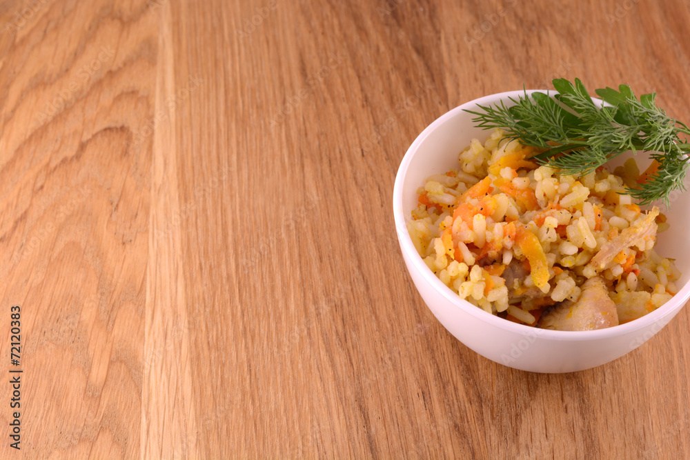 Chinese cuisine - fried rice with meat on wooden background Chinese cuisine - fried rice with meat on wooden background