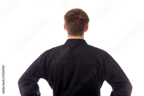 model isolated on plain background back hands on hips