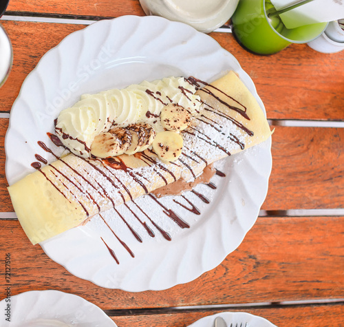 Cold crape with ice-cream chocolate and banana photo