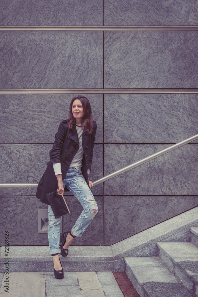 Fototapeta premium Pretty girl posing in the city streets