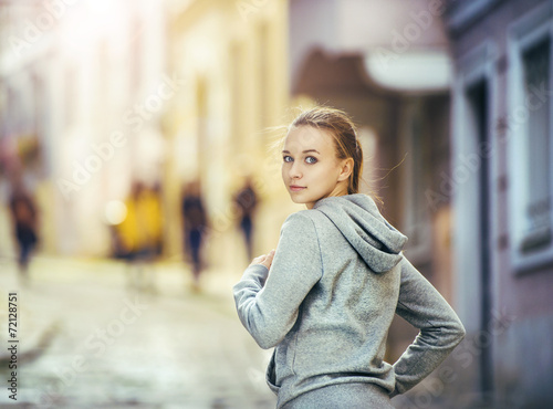 Wallpaper Mural Young woman running in city center Torontodigital.ca