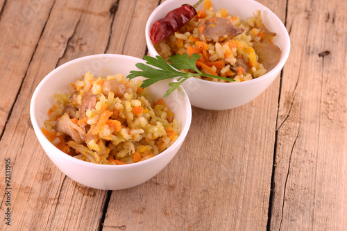 Chinese rice in a bowl on a wooden table photo