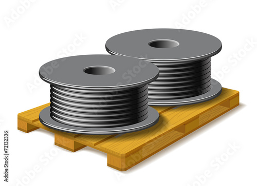 Coils with a black cord are on a wooden pallet.
