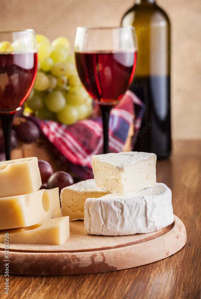 Cheese with a bottle and glasses of red wine Cheese with a bottle and glasses of red wine