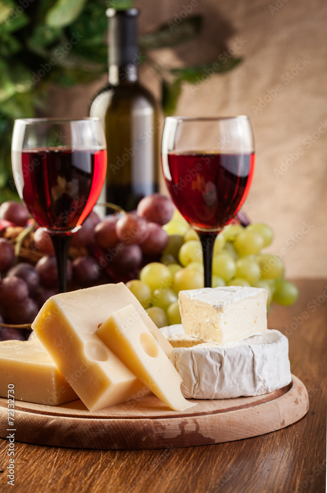 Cheese with a bottle and glasses of red wine Cheese with a bottle and glasses of red wine