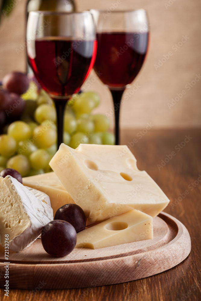 Cheese with a bottle and glasses of red wine