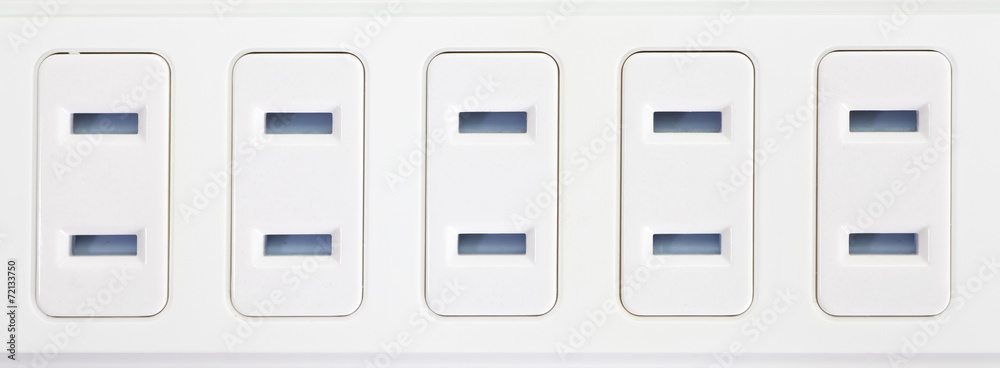 Close - up white extension power strip Close - up white extension power strip