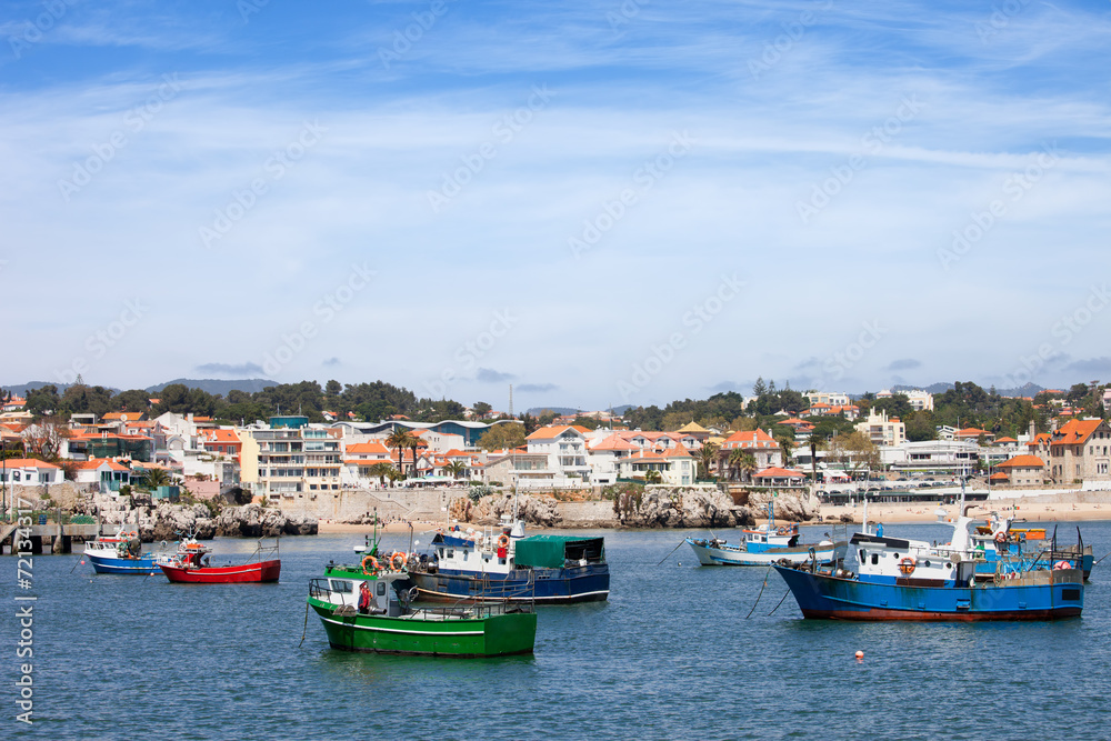 Fishing Boats and Cascais Coastline in Portugal