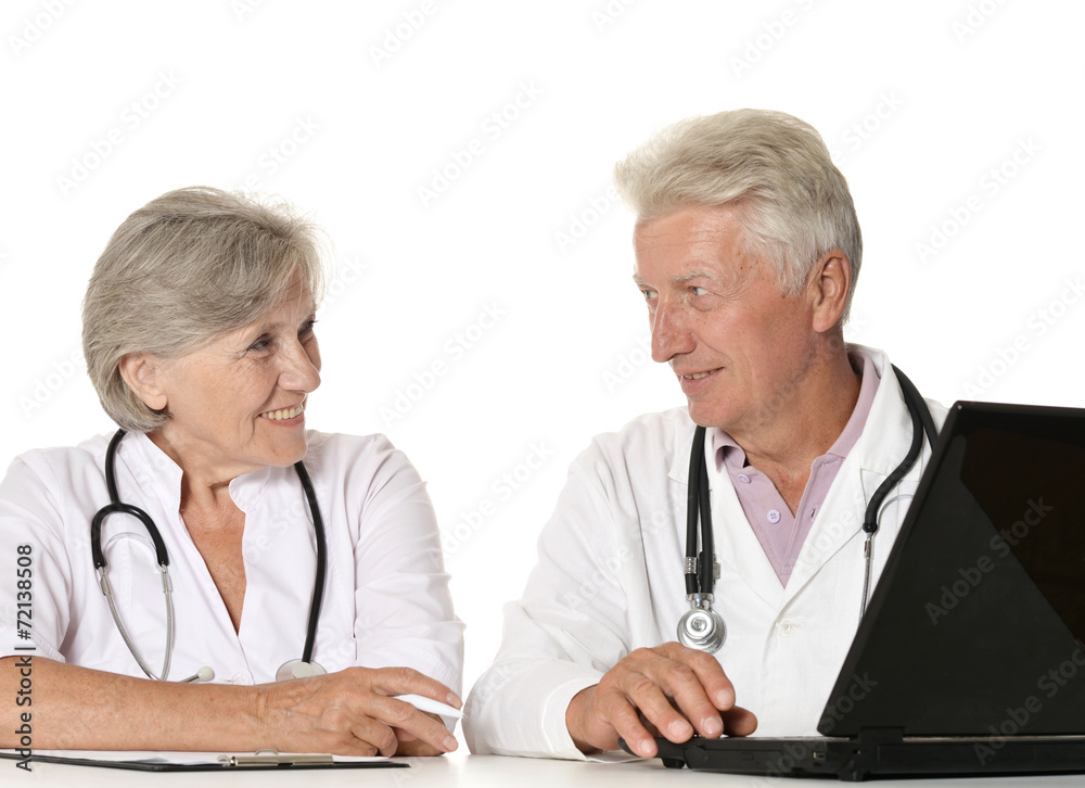 Elderly doctors with a laptop
