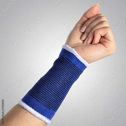 hand with a orthopedic wrist brace