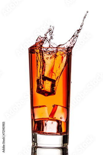 Ice splashing in cup of tea