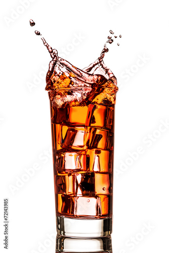 Ice splashing in cup of tea