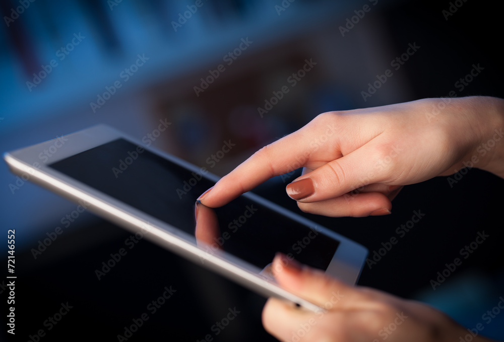 Finger pointing on tablet pc with empty space Finger pointing on tablet pc with empty space