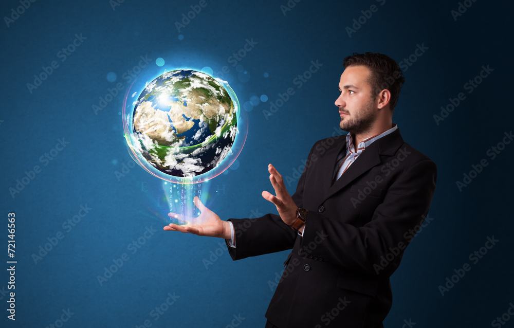 Businessman holding glowing earth globe Businessman holding glowing earth globe