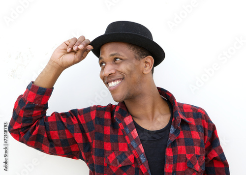 Trendy african man smiling with hat