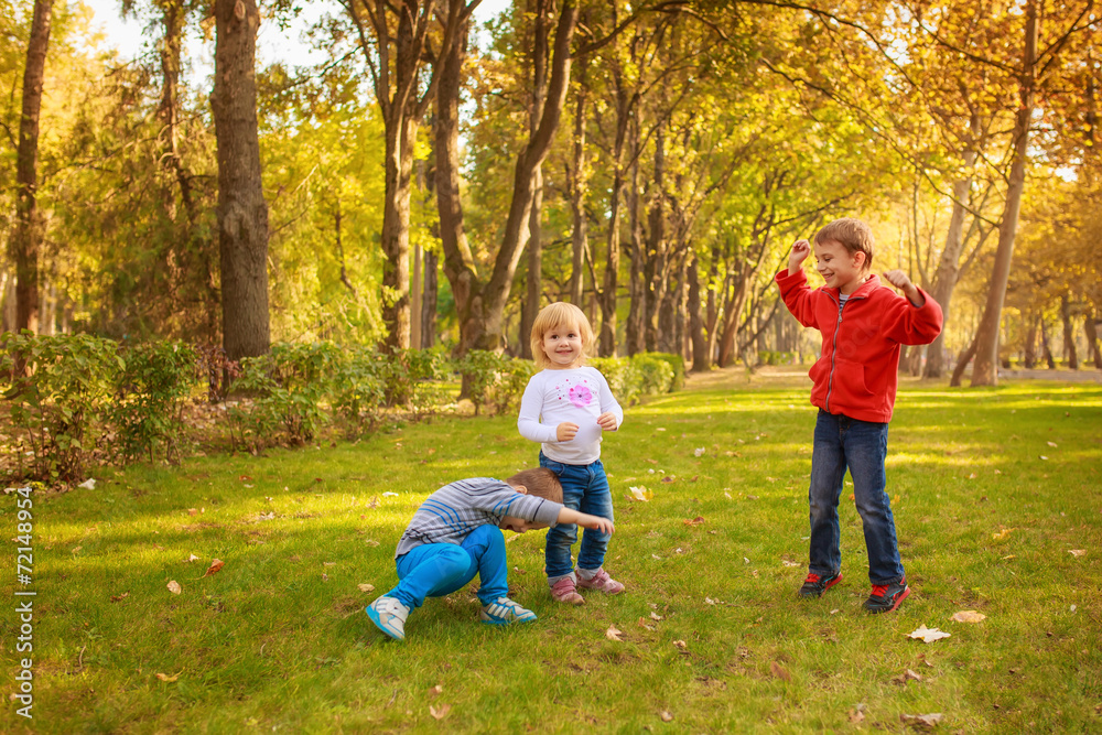 Fototapeta premium happy kids jumping in the park, joy, emotion