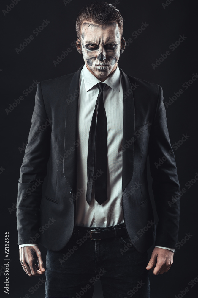 Portrait serious businessman  makeup skeleton