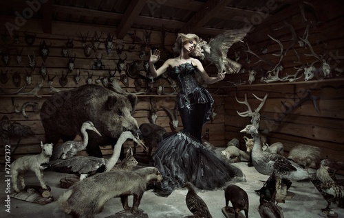 Canvas Print Innocent woman among wild animals