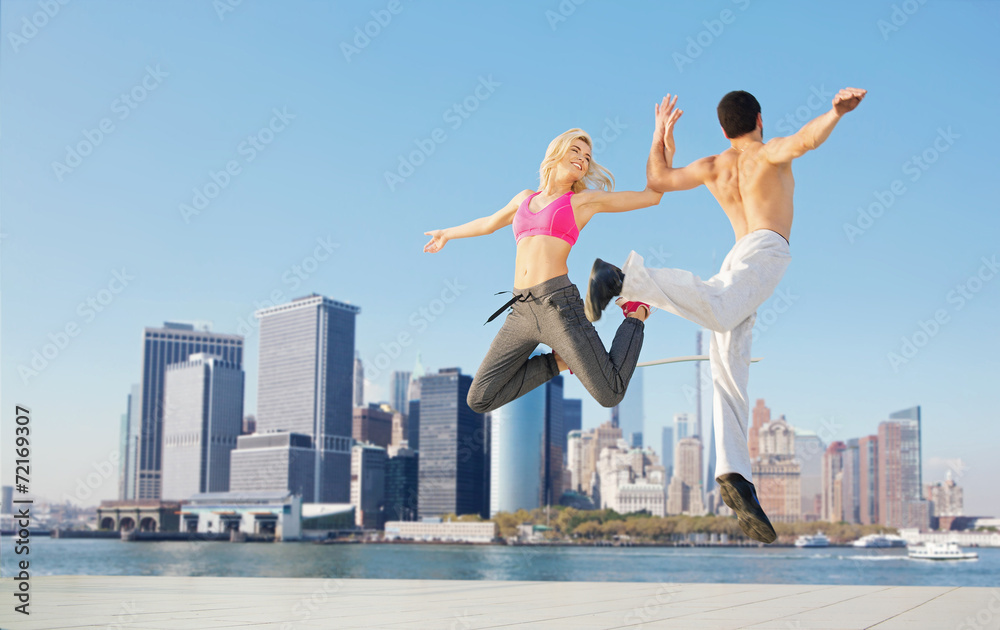 Cheerful young couple training together Cheerful young couple training together