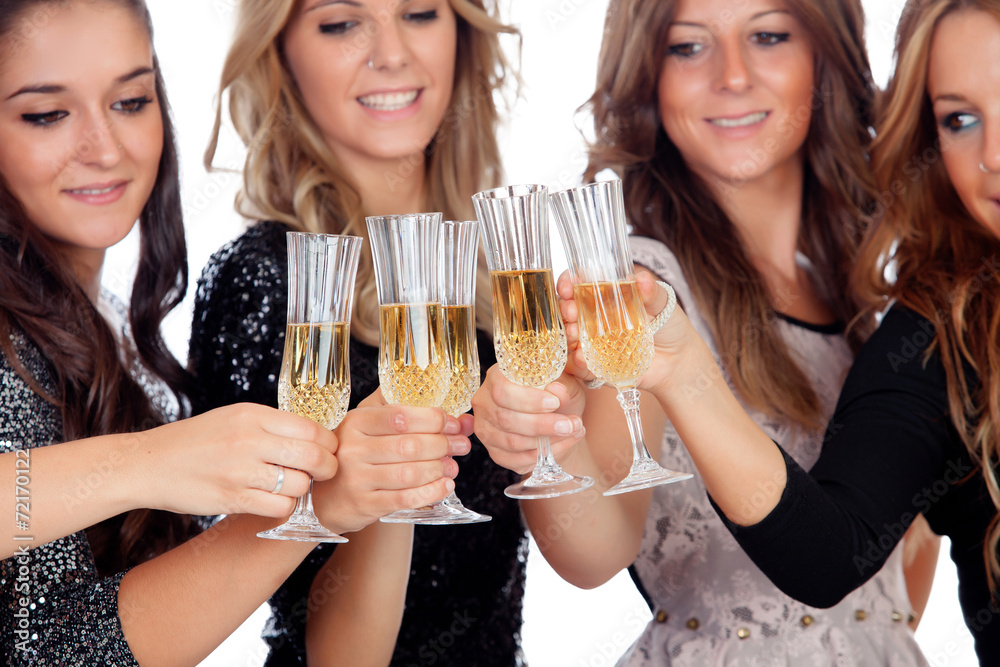 Group of friends toasting with champagne in Christmas Group of friends toasting with champagne in Christmas