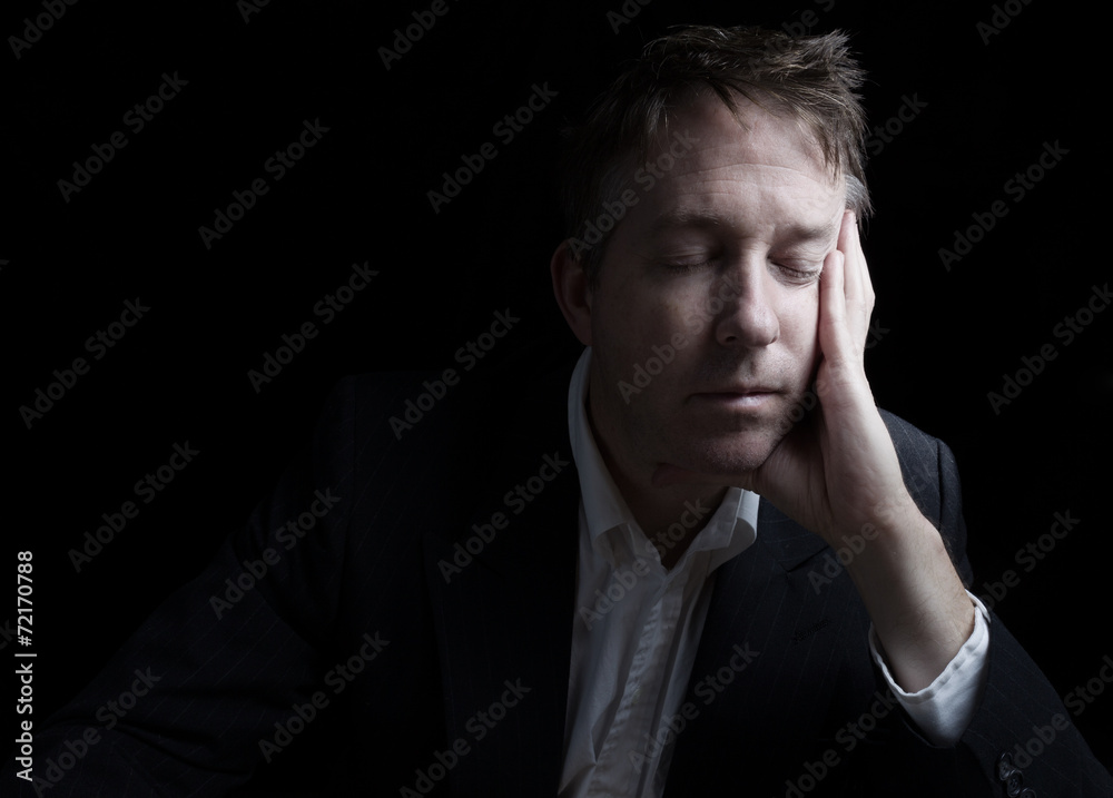 Unemployed depressed man resting his eyes Unemployed depressed man resting his eyes