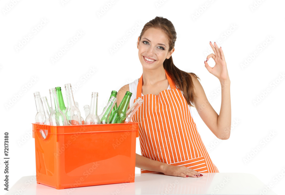 Young girl sorting glass bottles isolated on white Young girl sorting glass bottles isolated on white