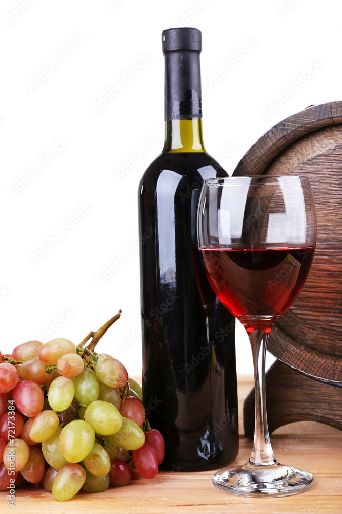 Wine in goblet and in bottle, grapes and barrel
