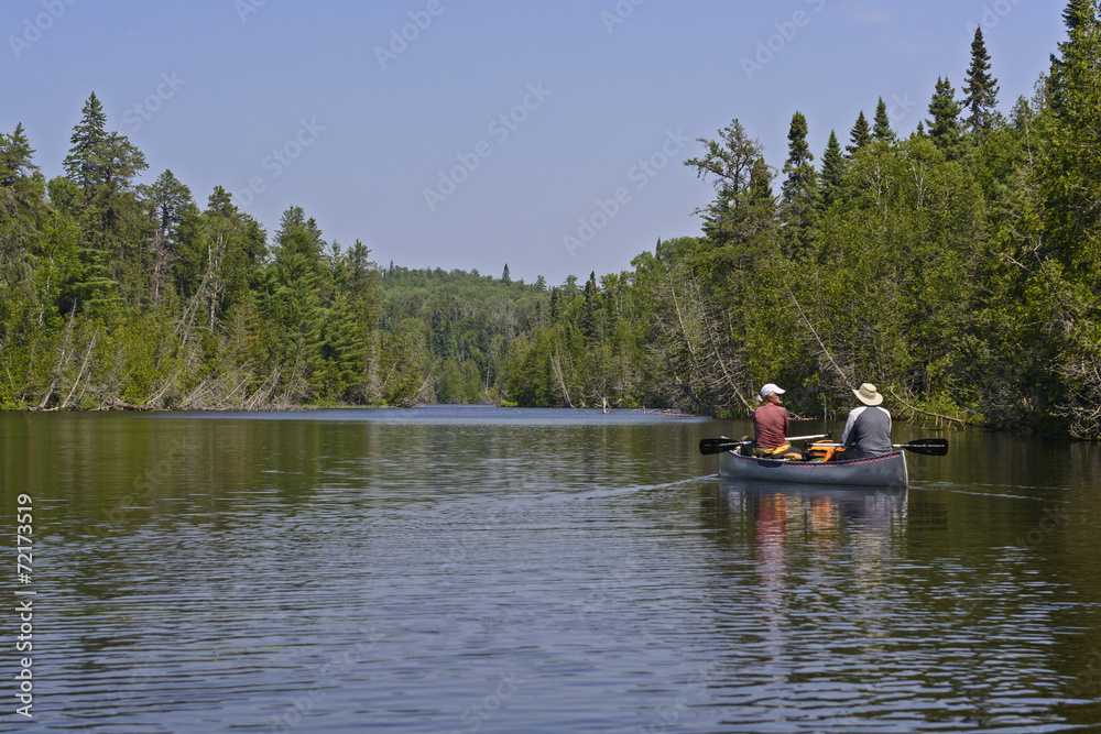 Canoers Heading into a North Woods lake