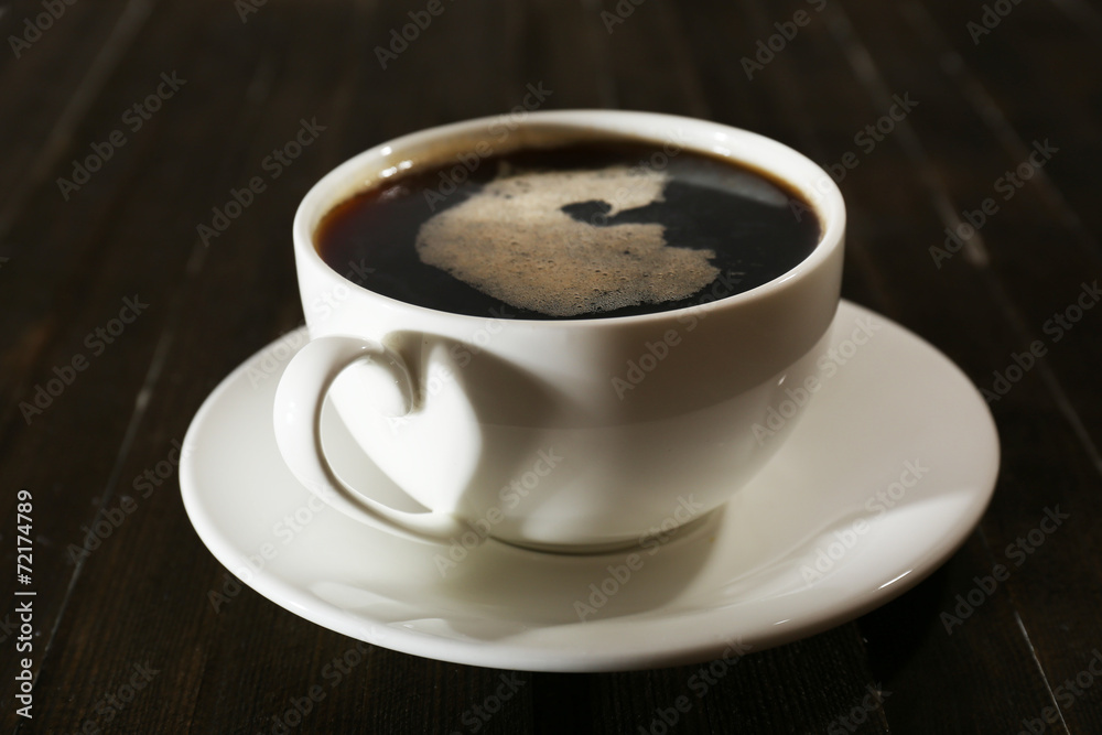 Fototapeta premium Cup of coffee on wooden table