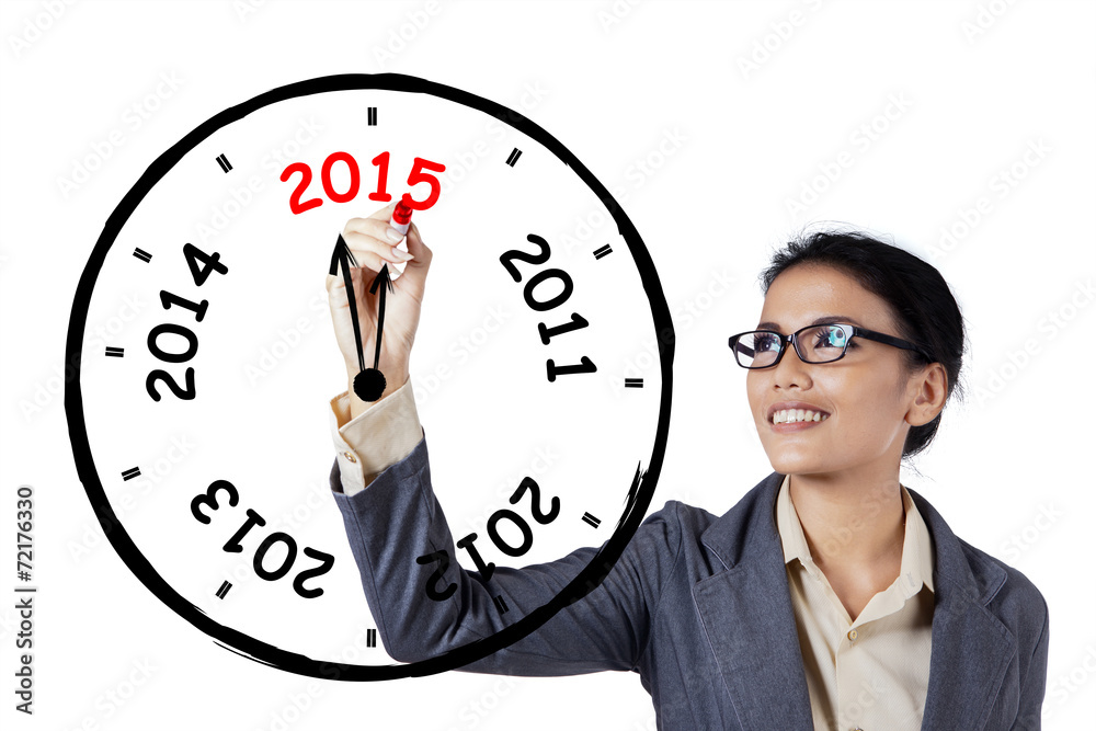 Businesswoman drawing annual clock Businesswoman drawing annual clock