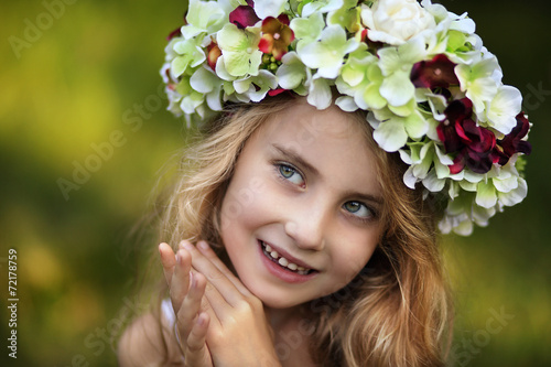 Young girl in a floral wreath