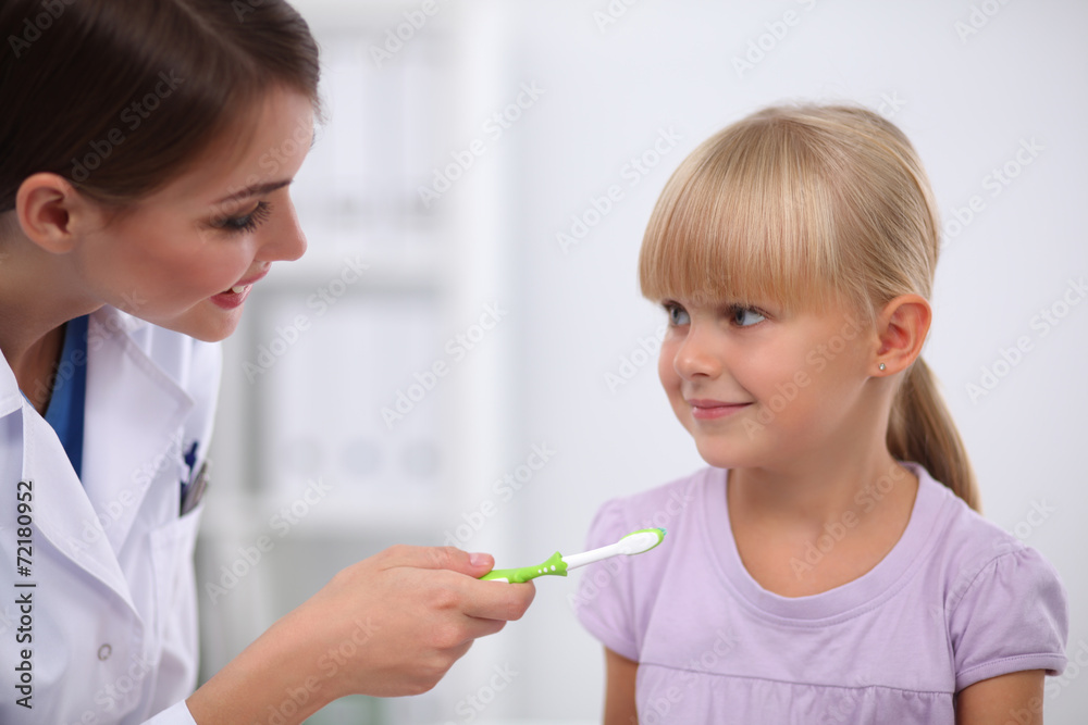 Dentist and little girl in the dentist office. Dentist and little girl in the dentist office.