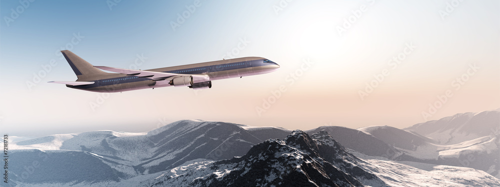 Verkehrsflugzeug über einem Gebirge in der Morgensonne