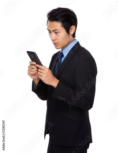 Businessman read on cellphone