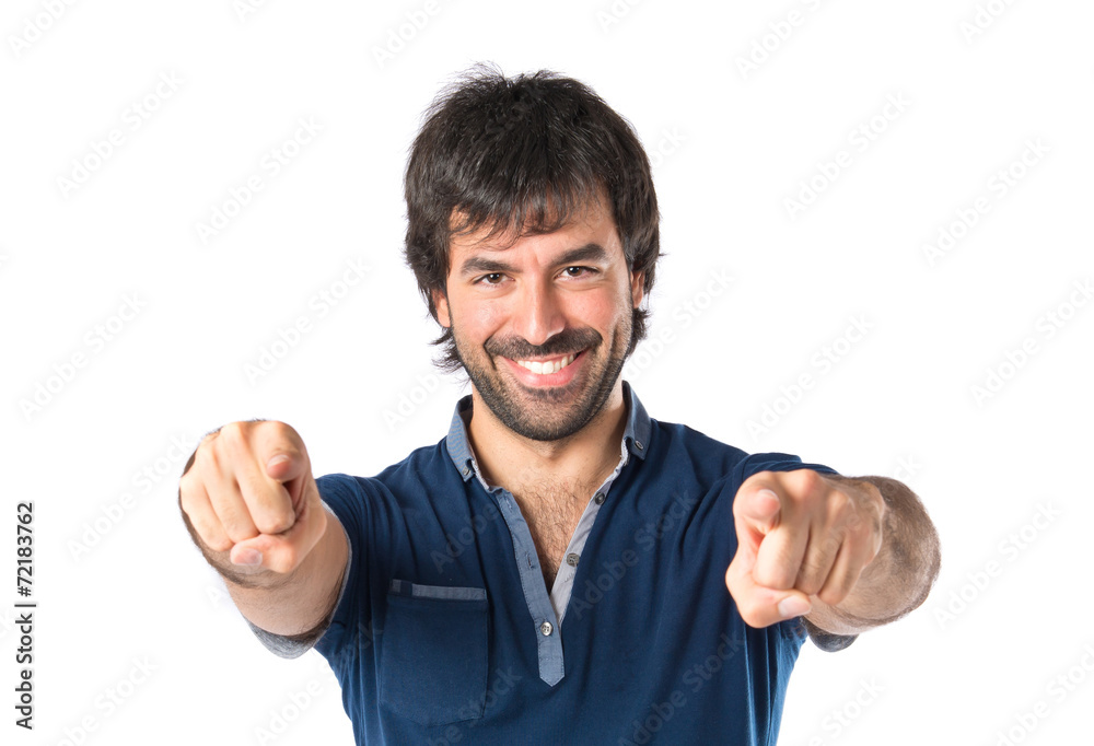 Man pointing to the front over white background Man pointing to the front over white background