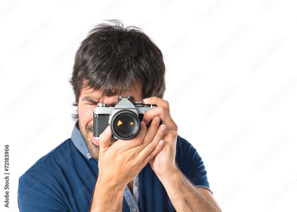 Man photographing over white background Man photographing over white background