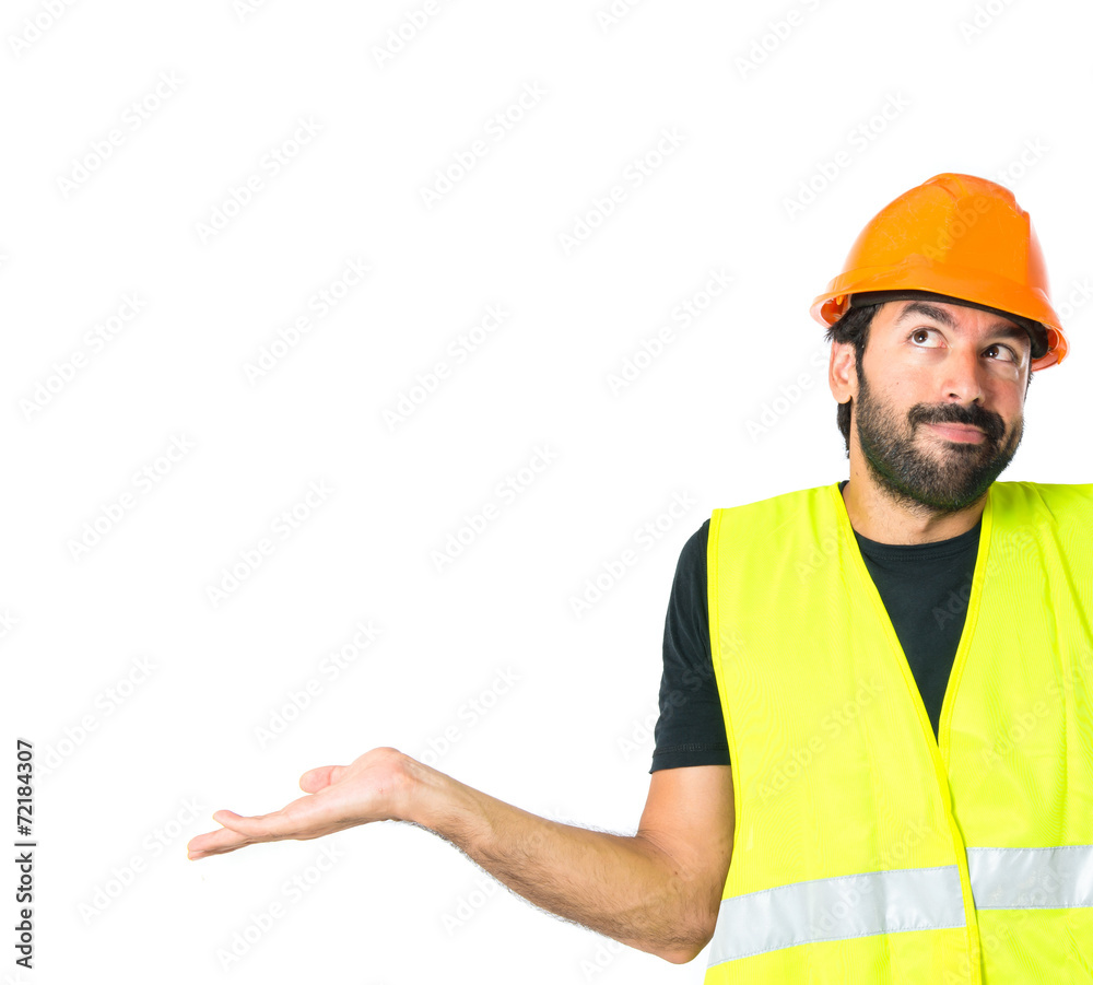 Workman having doubts over isolated white background Workman having doubts over isolated white background