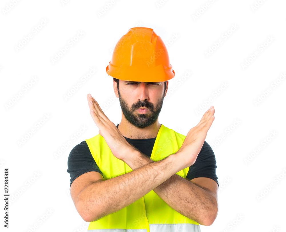 Workman making stop sign over white background Workman making stop sign over white background