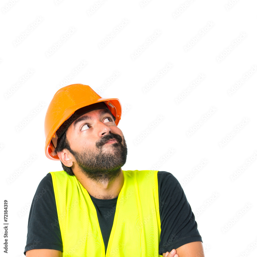 Workman with his arms crossed over white background Workman with his arms crossed over white background