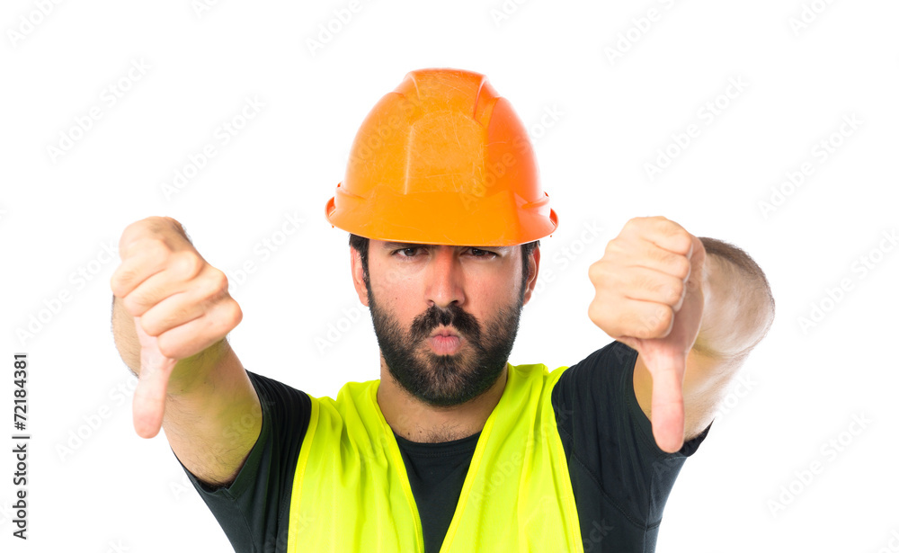 Workman doing a bad signal over white background Workman doing a bad signal over white background