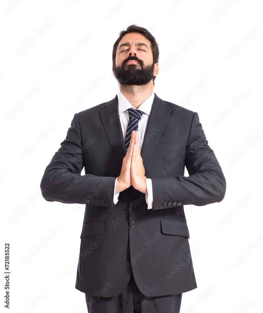 Businessman in zen position over white background Businessman in zen position over white background