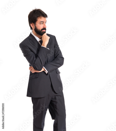 Businessman thinking over isolated white background