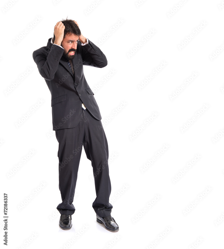 Frightened businessman over isolated white background Frightened businessman over isolated white background