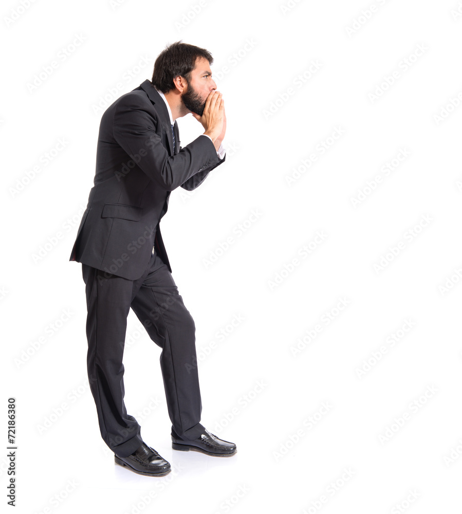 Businessman shouting over isolated white background Businessman shouting over isolated white background