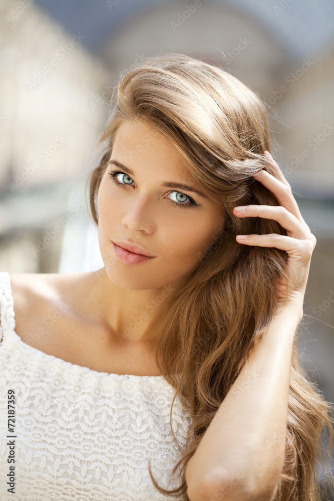 Young beautiful woman in white dress Young beautiful woman in white dress