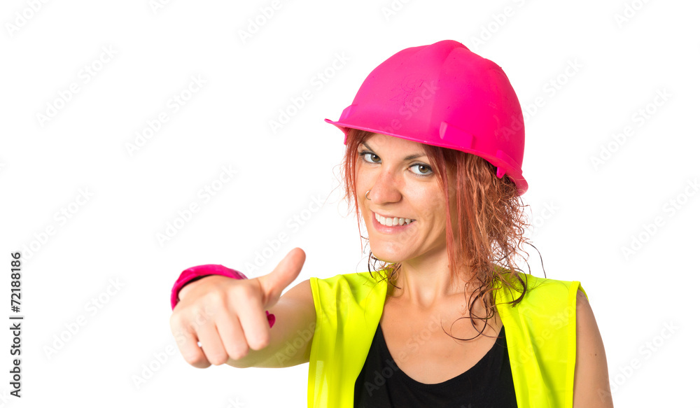 Worker woman making Ok sign over white background Worker woman making Ok sign over white background