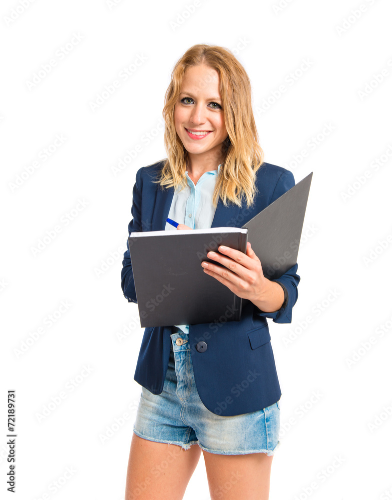 Girl writting in a book over white background Girl writting in a book over white background